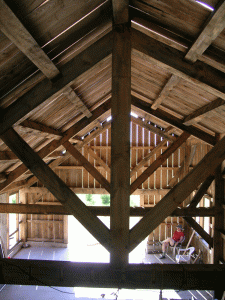 rafters The shape of these rafters always makes me think of someone throwing their arms into the sky in pure jubiliation. This will be our view in the loft -- once we get the floor boards in.