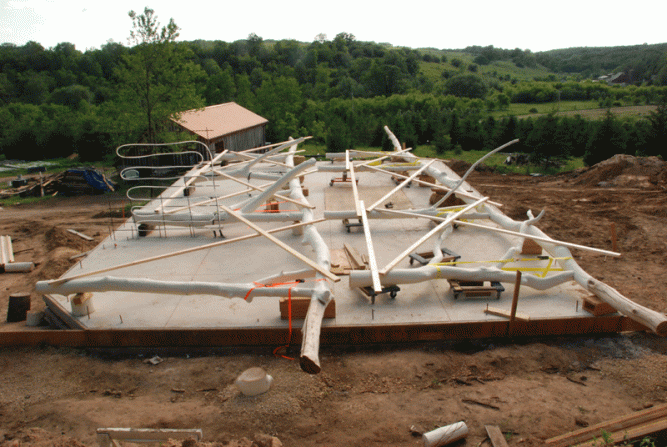 Two bents were assembled on the floor, the third was waiting on the ground.