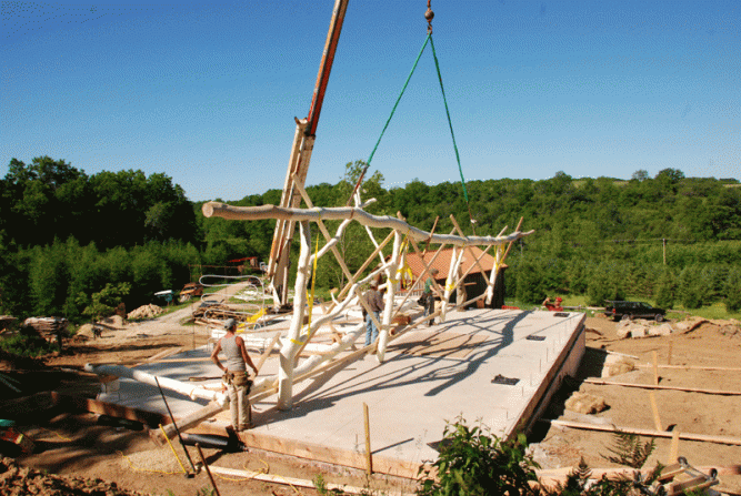 Hoisting the bents into place with a crane.
