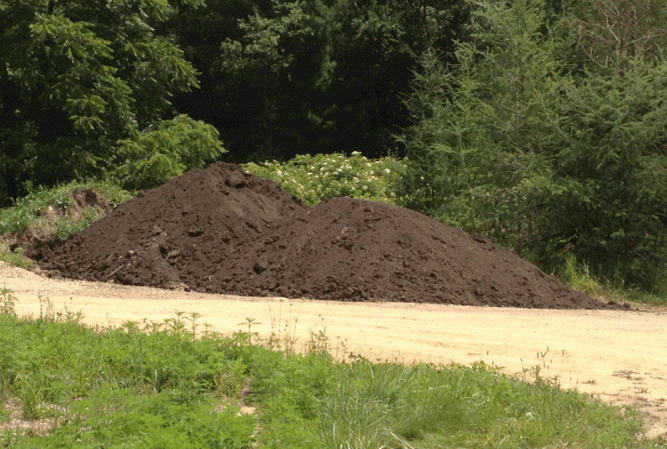 The top 1-2 feet of dirt is very special soil.  It came from the next valley where the Prairie enthusiasts are restoring a stream to its pre-settlement conditions.  That means removing all the dirt that eroded from the top of the hills as soon as settlers started to plow the prairie.  This is the rich stuff that the tall prairie plants flourished in.  It's an honor to have it in our garden!