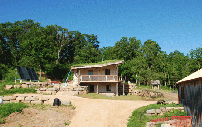 Solar panels to the left (north) cob oven to the right.  