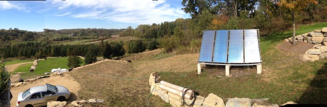 Our buried boulder is just to the left behind the solar panels. Rest in peace.
