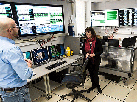  Jerrold Robaidek, left, describes satellite weather imagery displayed on computer monitors as Marsha Mailick, vice chancellor for research and graduate education, tours the Space Science and Engineering Center (SSEC) Data Center in the Atmospheric, Oceanic and Space Sciences (AOSS) Building at the University of Wisconsin-Madison on Dec. 4, 2014. Robaidek is program manager of the SSEC Data Center. At right is Steven Ackerman, professor of atmospheric and oceanic sciences, and director of the Cooperative Institute for Meteorological Satellite Studies (CIMSS).(Photo by Jeff Miller/UW-Madison)